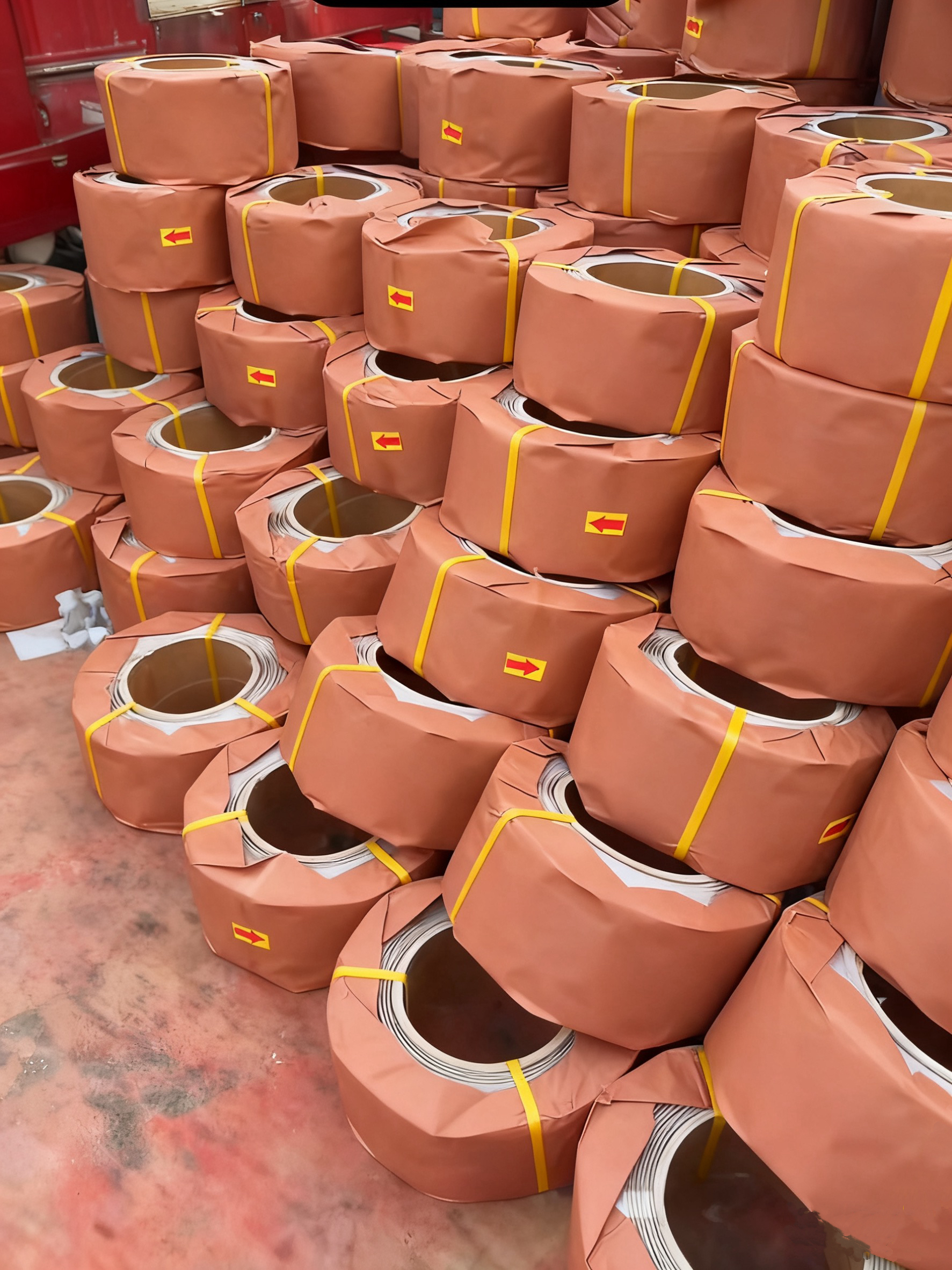 Factory stock photo showing rolls of PP strapping ready for shipment.