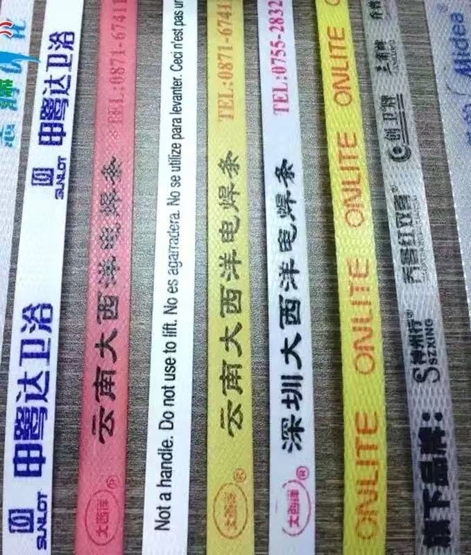 Printed PP strapping with warning or branding text for customized packaging.